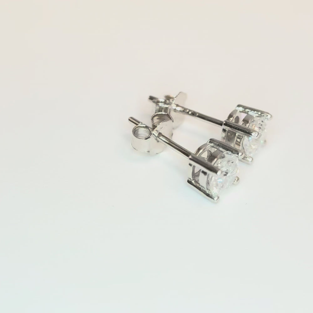 
                  
                    Load and play video in Gallery viewer, 4mm Round Lab Diamond Studs in Sterling Silver
                  
                